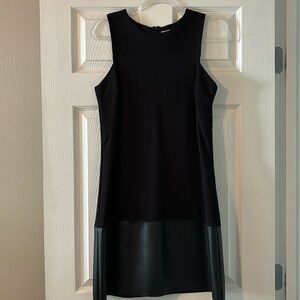 Black cocktail dress with leather accent